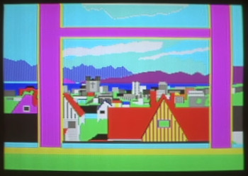 Cartoon-like view in bright colours of houses, buildings, blue sky, ocean and mountains behind